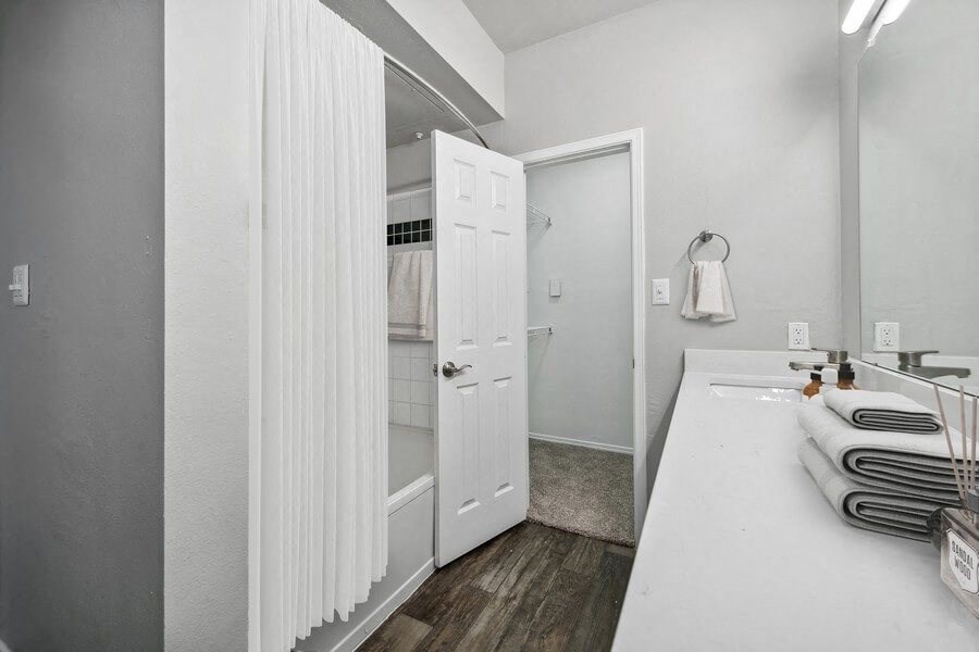 Model bathroom and hallway at Bridges at Oakbend, Lewisvillle, 75067