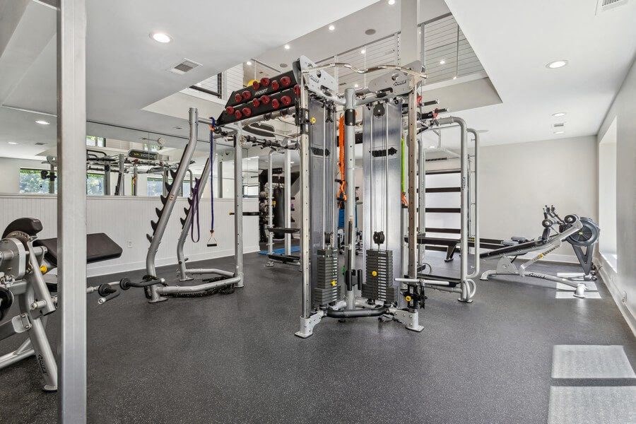 Community Fitness Center with Equipment and Upstairs Area at Dunwoody Village Apartments in Atlanta, GA.