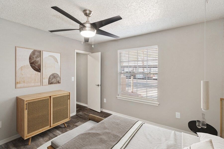 Model bedroom showcasing large windows