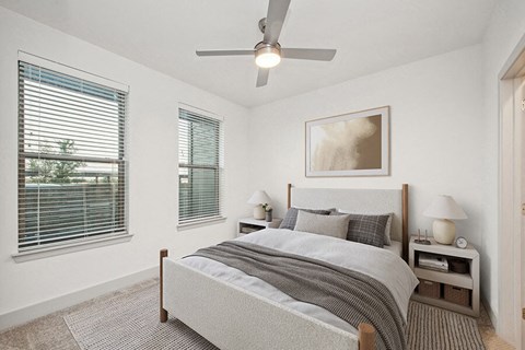Model Bedroom with Carpet and Window View at Alta 3Eighty Apartments located in Aubrey, TX.