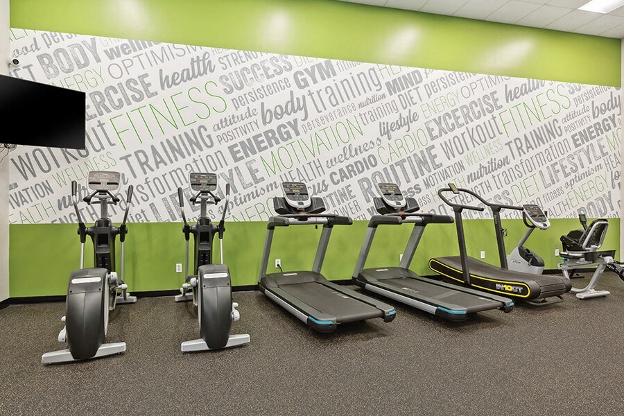 Community Fitness Center with Equipment at Grand Pavilion Apartments in Tampa, FL.