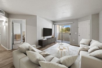 Model living room showcasing private patio door - Photo Gallery 2