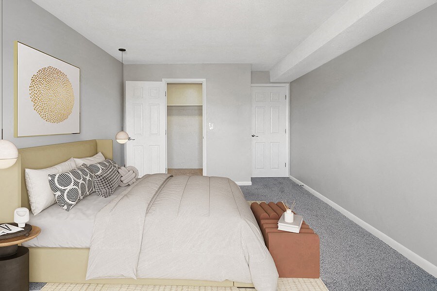 Model Bedroom with Carpet & Walk In Closet at Stone Ends Apartments in Stoughton, MA.