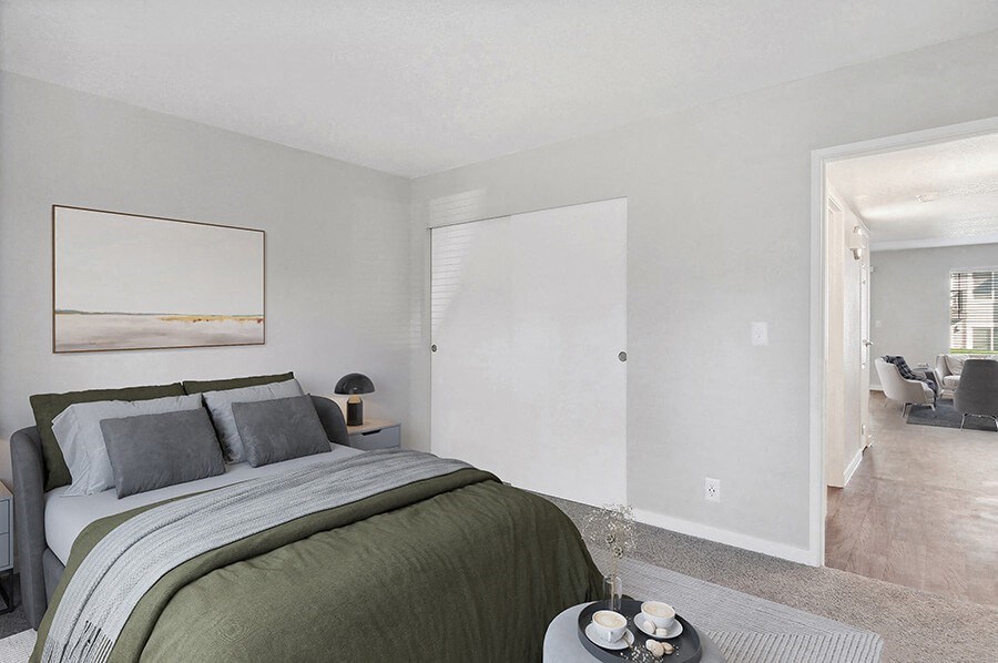 Model Bedroom with Carpet and Closet at Overlook Point Apartments in Salt Lake City, UT.