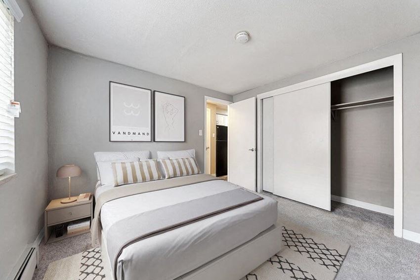 Model bedroom with sliding door closet at Esprit Cherry Creek
Apartments in Glendale, CO