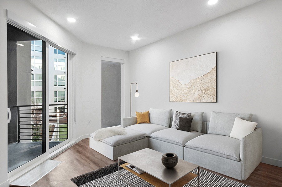 Model living room with sofas at Post House North located in Post District Residences in downtown Salt Lake City, Utah