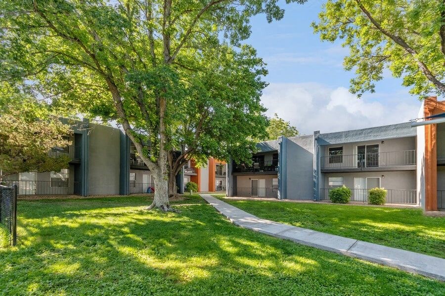 Exterior Community Building and Landscape at Indigo Park Apartments in Albuquerque, NM.