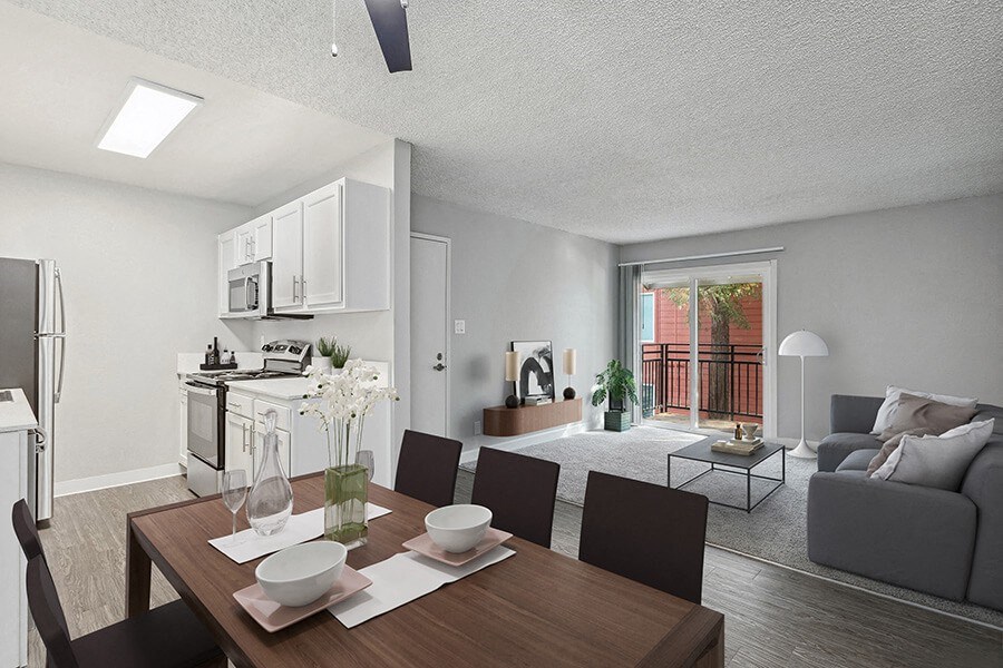 Model Living Room with Wood-Style Flooring and View of Kitchen/Living Room Area at The Archer Apartments in Sacramento, CA.
