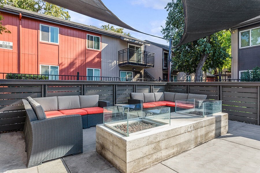 Community Fire Pit Area with Patio Furniture at The Archer Apartments in Sacramento, CA.
