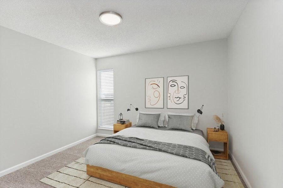 Model bedroom with queen-size bed