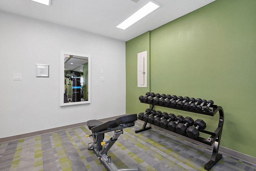 Community Fitness Center with Equipment at Crystal Creek Apartments in Phoenix, AZ.