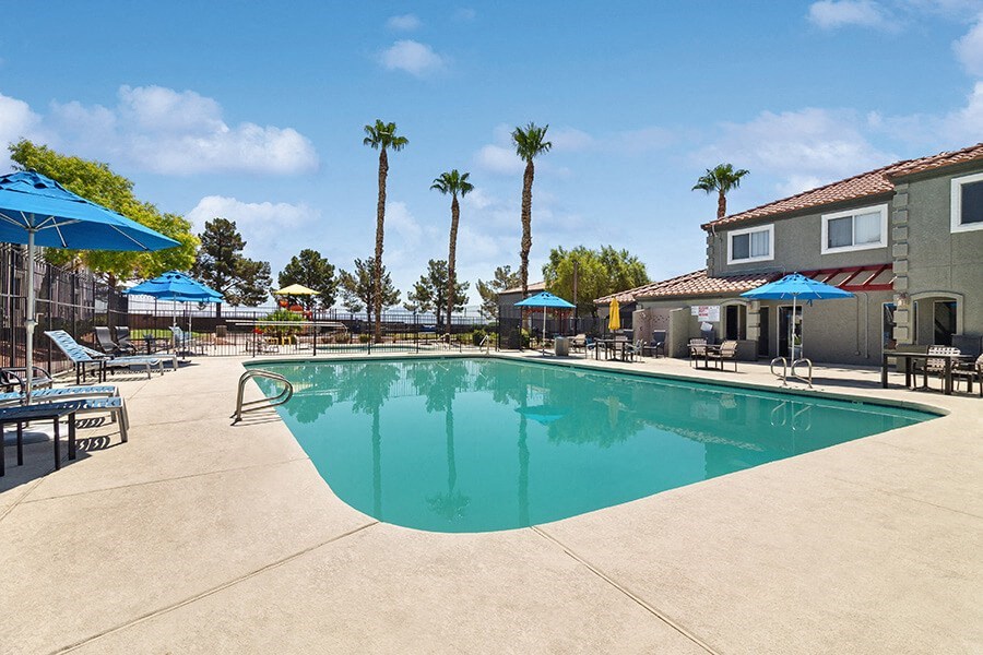 Community Swimming Pool with Pool Furniture at Loma Vista Apartments in Las Vegas, NV.
