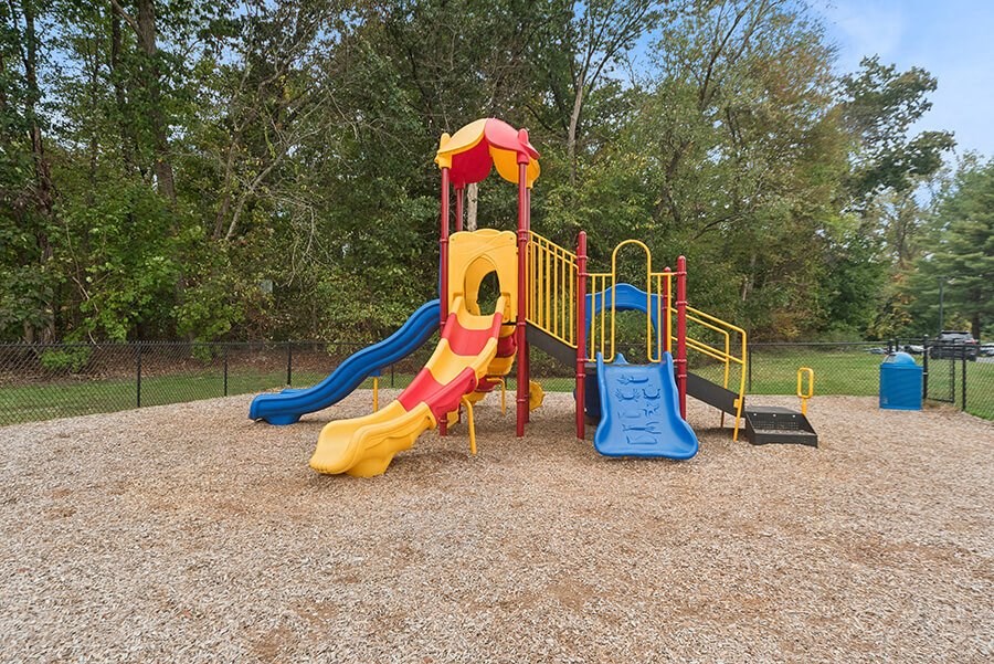 Community Playground with Two Slides at Meadows at Marlborough Apartments located in Marlborough, MA.at Meadows at Marlborough Apartments located in Marlborough, MA.