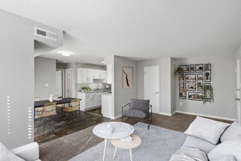 Model living room showcasing wide open living space - Photo Gallery 4