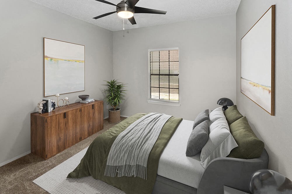 Model Bedroom with Carpet and Window View at Dallas North Park Apartments in Dallas, TX.