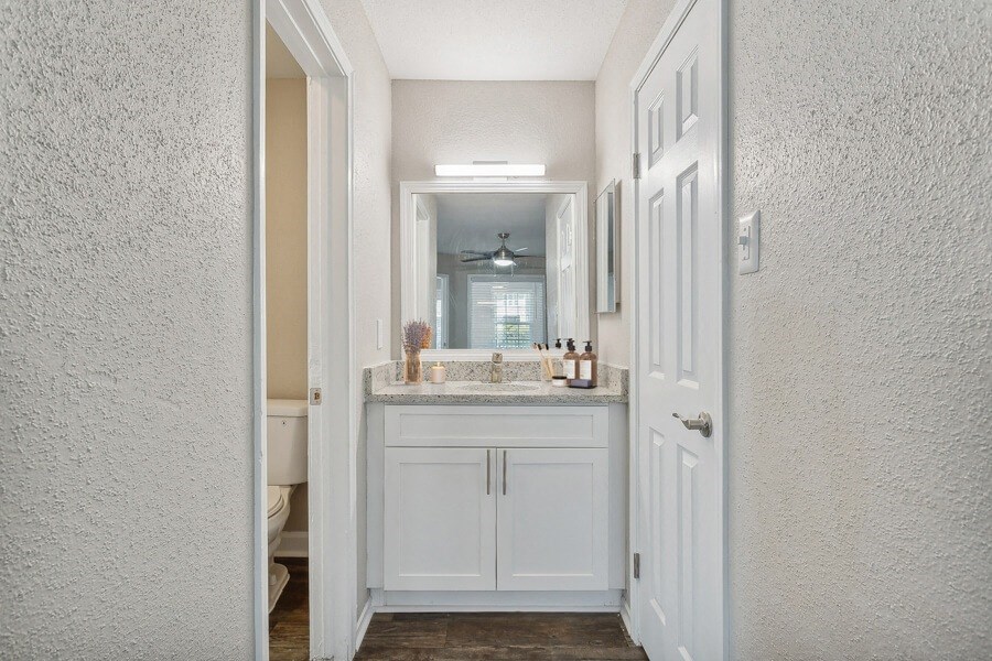 a view of a bathroom with a white door