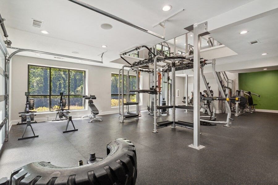 Community Fitness Center with Equipment and Upstairs Area at Dunwoody Village Apartments in Atlanta, GA.