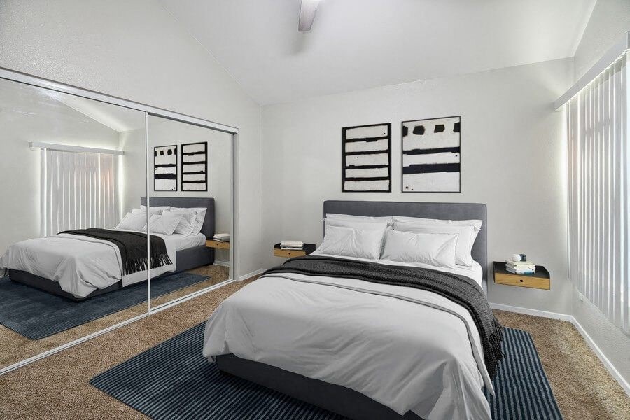 Model bedroom with mirror door closet