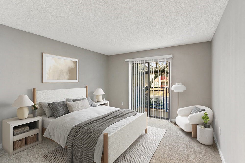 Model Bedroom with Carpet and Window View at Grandstand Apartments in Marietta, GA.