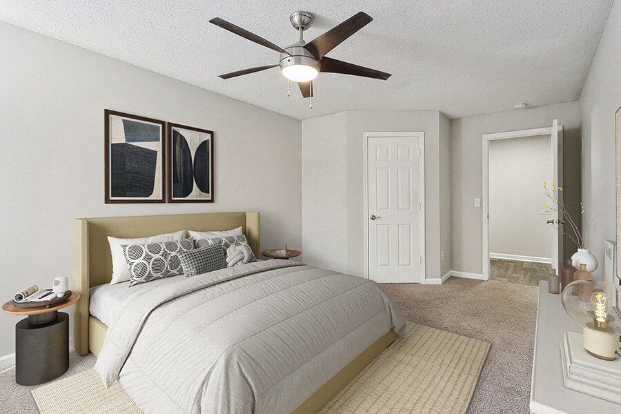 Model Bedroom with Carpet and Hallway View at Retreat at Stonecrest Apartments located in Lithonia, GA.