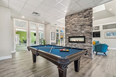 Community area with billiards table and fireplace