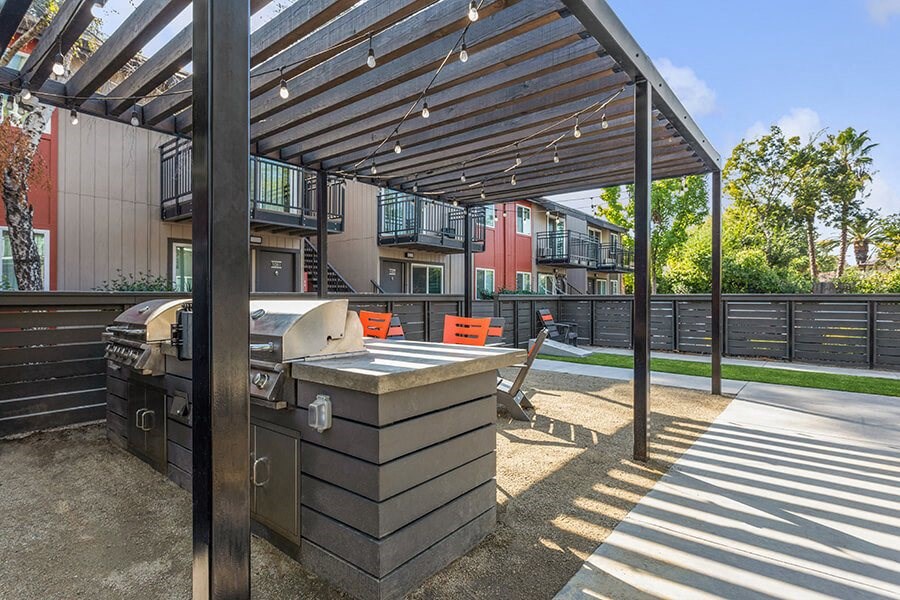 Outdoor BBQ Area with Furniture at The Archer Apartments in Sacramento, CA.