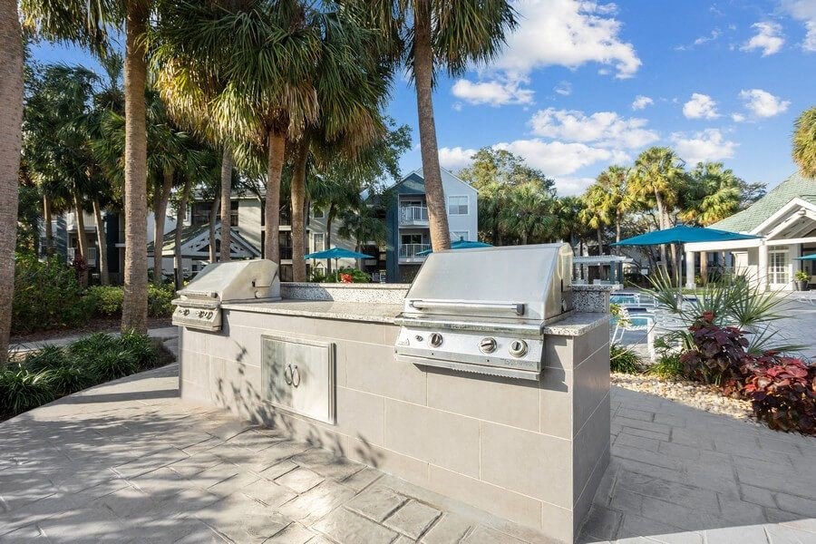 Outdoor Grilling Area at Caribbean Breeze Apartments in Tampa, FL.