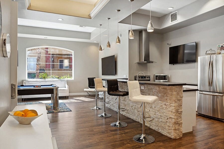 Community Clubhouse with Kitchenette and Pool Table at Reserve at Rancho Belago Apartments in Moreno Valley, CA.