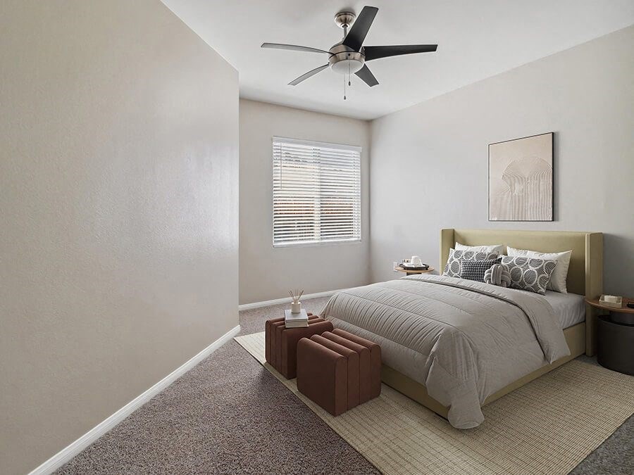 Model Bedroom with Carpet and Window View at Reserve at Rancho Apartments located in Moreno Valley, CA.