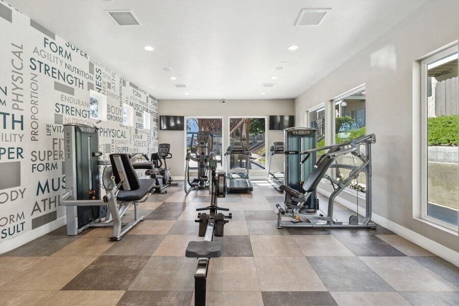 Community Fitness Center with Equipment & Window View at Forest Park Apartments in El Cajon, CA.
