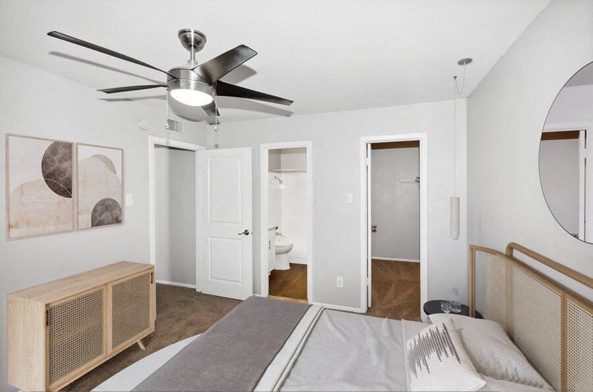 Model primary bedroom with walk-in closet - Photo Gallery