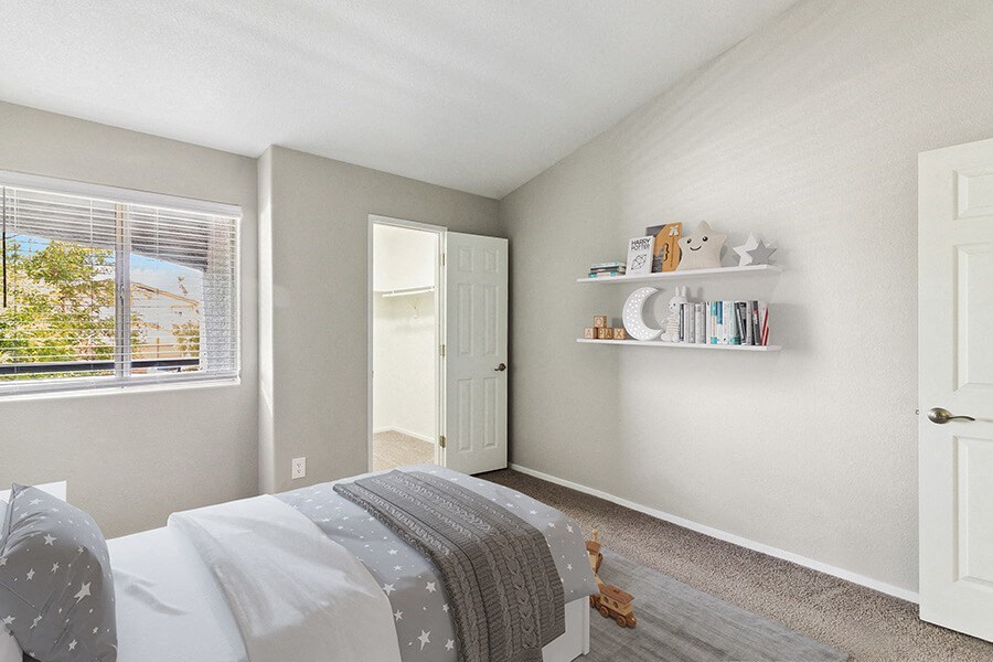 Model Bedroom with Carpet & Walk in Closet at Verraso Apartments in Las Vegas, NV.
