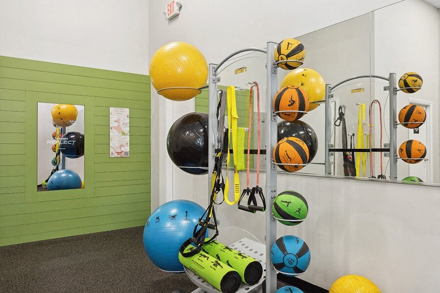 Community Fitness Center with Equipment at Grand Pavilion Apartments in Tampa, FL.
