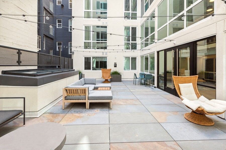 Outdoor lounge with patio furniture at TL Residences