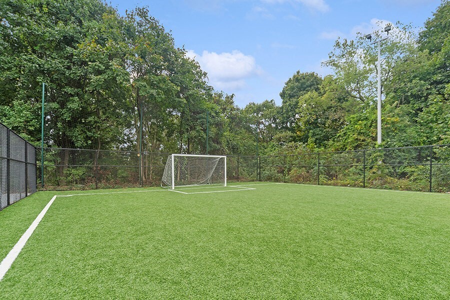 Community Soccer Field with Nets at Heights at Marlborough Apartments located in Marlborough, MA.