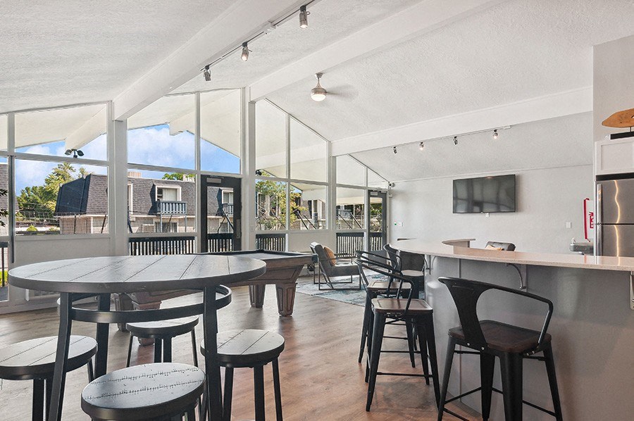 Community Clubhouse with Island Bar and Lounge Furniture at Monaco Apartments in Salt Lake City, UT.