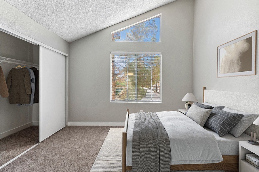 Model Bedroom with Carpet and Closet at Meadow Ridge Apartments in Las Vegas, NV.