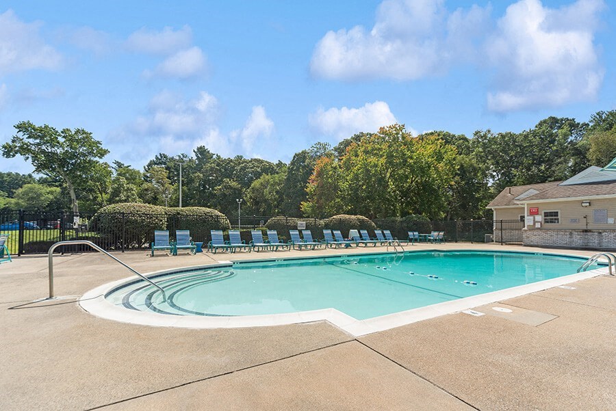 Community Swimming Pool with Pool Furniture at Meadows at Marlborough Apartments in Boston, MA.