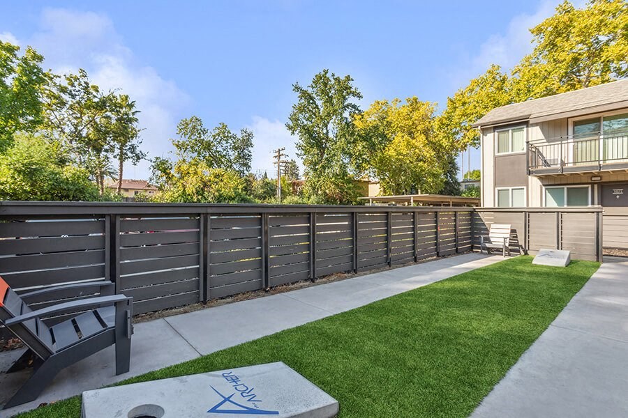 Outdoor Corn Hole Area at The Archer Apartments in Sacramento, CA.