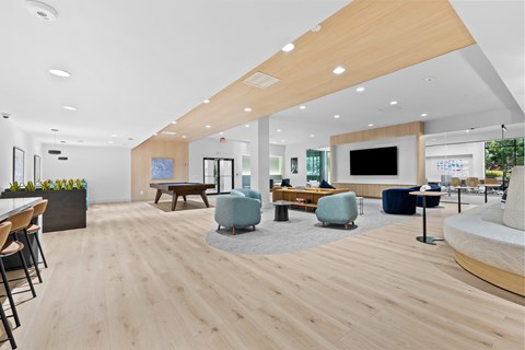 A modern office space with wooden floors and furniture.