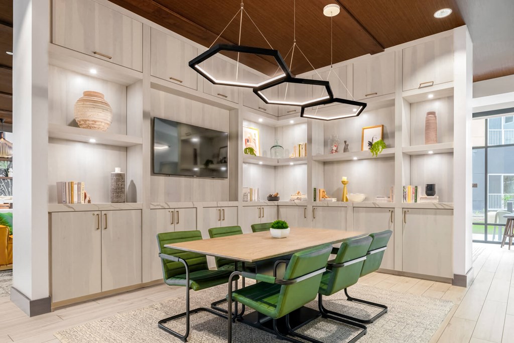 Business center interior with large table and tv