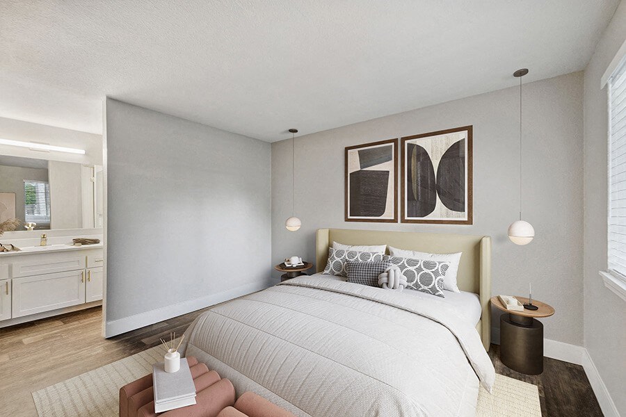 Model Bedroom with Wood-Style Flooring and attached Bathroom at Central Flats Apartments in Kent, WA.