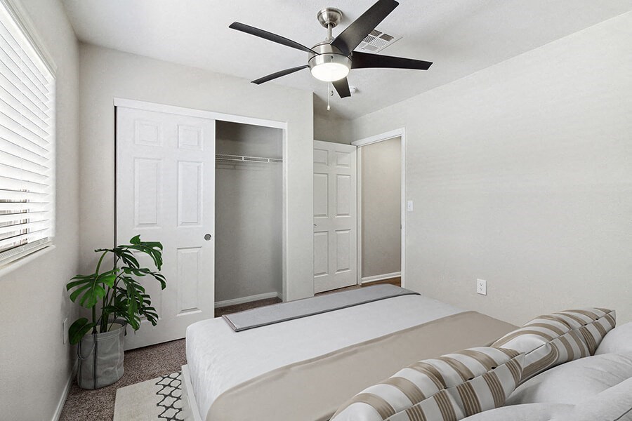 Model Bedroom with Carpet and Closet at Loma Vista Apartments in Las Vegas, NV.