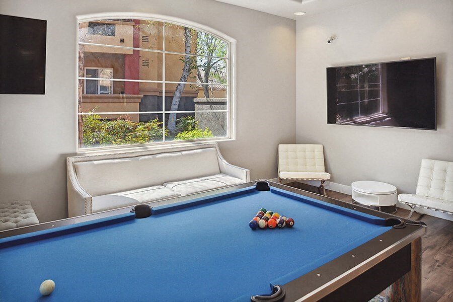 Community Clubhouse Pool Table at Reserve at Rancho Belago Apartments in Moreno Valley, CA.