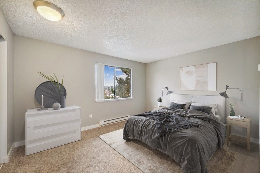 Model bedroom with window and updated carpeting