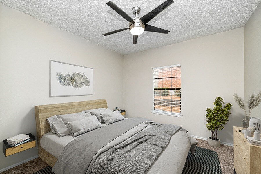 Model Bedroom with Carpet and Window View at Dallas North Park Apartments in Dallas, TX.