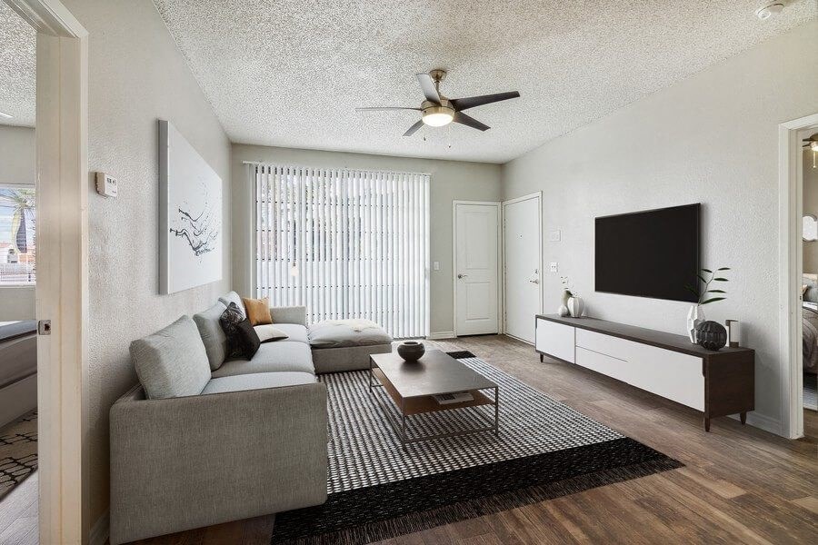 a living room with a couch a coffee table and a tv