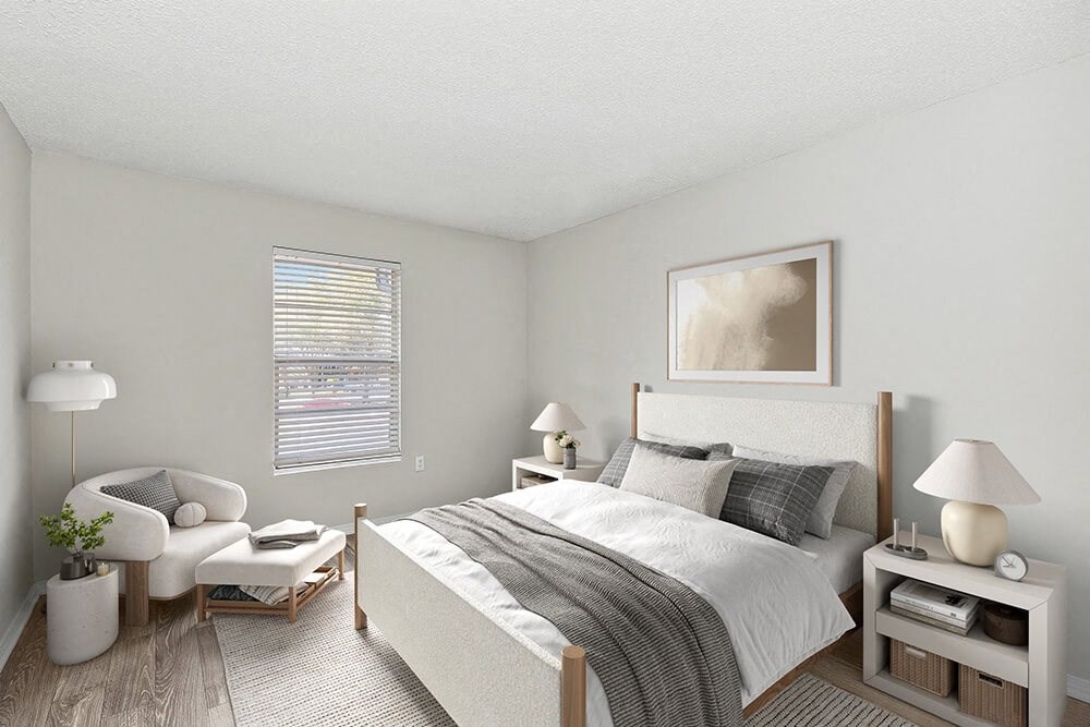 Model Bedroom with Carpet and Window View at Seven Lakes at Carrollwood Apartments in Tampa, FL.