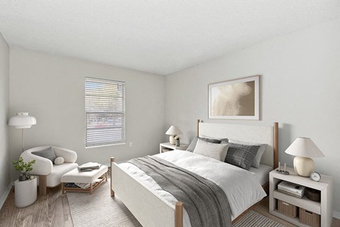 Model Bedroom with Carpet and Window View at Seven Lakes at Carrollwood Apartments in Tampa, FL.