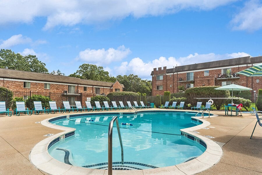 Community Swimming Pool with Pool Furniture at Heights Marlborough Apartments in Boston, MA.